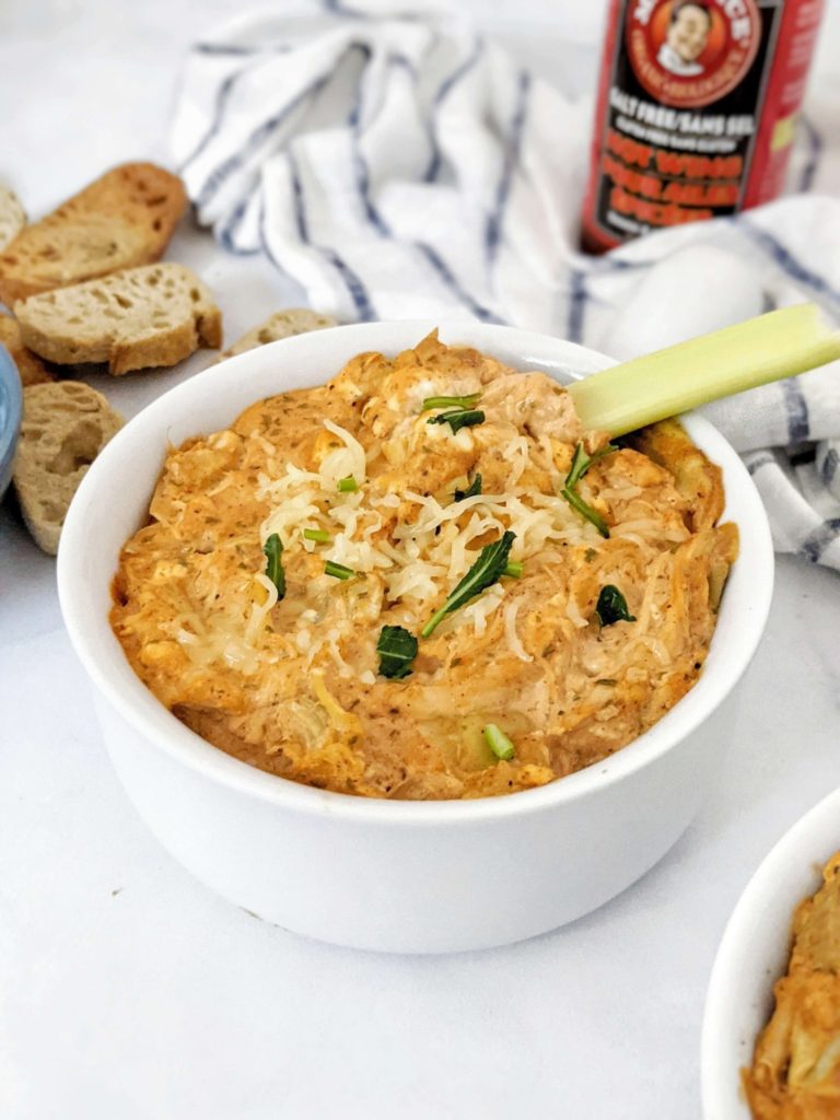Baked Buffalo Chicken Artichoke Dip made with shredded chicken, Greek Yogurt and low sodium wing sauce really is the best healthy dip you can get. A low calorie skinny buffalo chicken dip with artichoke for volume and nutrition perfect for a super bowl appetizer.