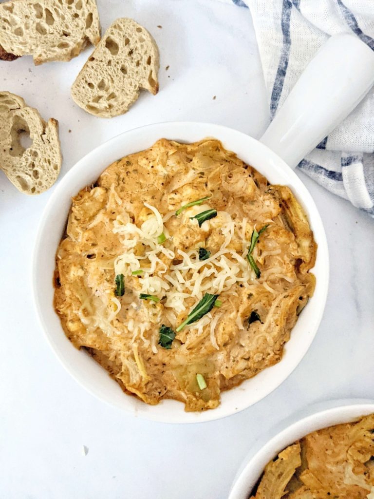 Baked Buffalo Chicken Artichoke Dip made with shredded chicken, Greek Yogurt and low sodium wing sauce really is the best healthy dip you can get. A low calorie skinny buffalo chicken dip with artichoke for volume and nutrition perfect for a super bowl appetizer.