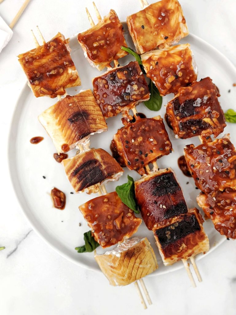 These Korean BBQ Glazed Salmon Skewers you need to try! Flaky grilled gochujang salmon kebabs coated in a sweet and spicy Korean barbecue sauce perfect for an easy Asian inspired dinner at home.