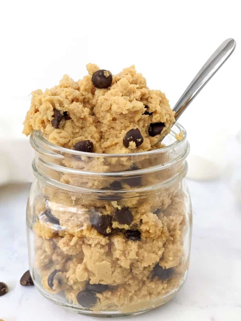 An edible low calorie Protein Chickpea Cookie Dough made with protein powder, peanut butter powder and sugar free chocolate chips. This healthy cookie dough recipe is Vegan and Gluten free too - the perfect protein powder and chickpea dessert.