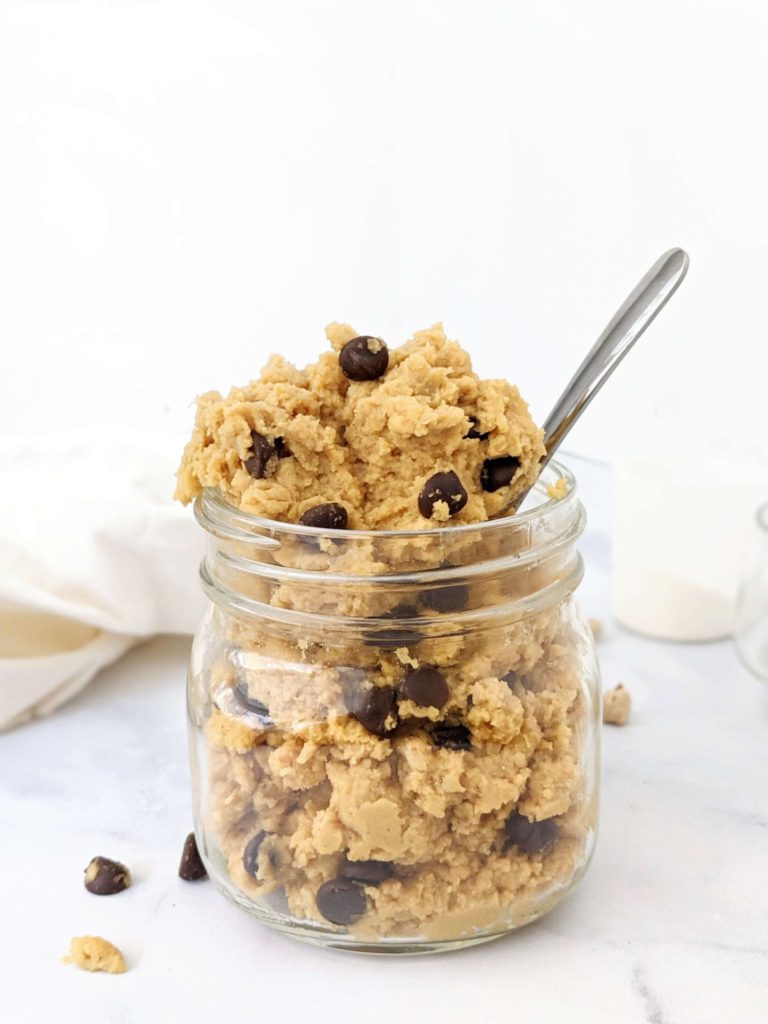 An edible low calorie Protein Chickpea Cookie Dough made with protein powder, peanut butter powder and sugar free chocolate chips. This healthy cookie dough recipe is Vegan and Gluten free too - the perfect protein powder and chickpea dessert.