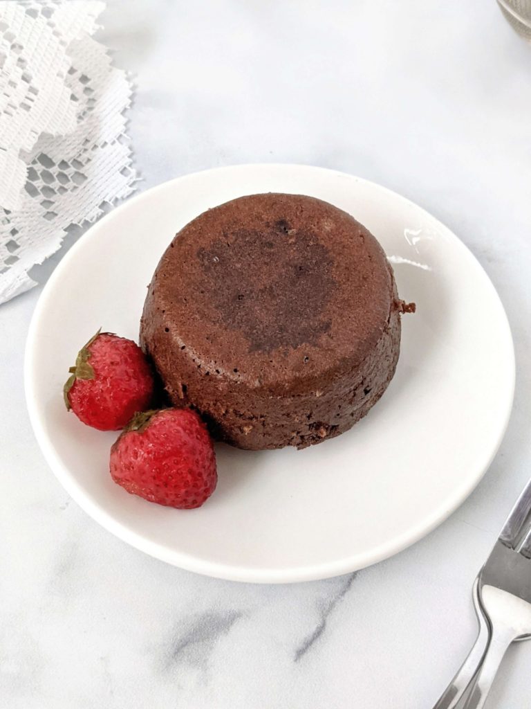 An easy and healthy Protein Chocolate Lava Cake for One made with protein powder and cocoa powder. This protein lava cake is sugar free and has the molten chocolate center with no butter needed - a perfect indulgent dessert!