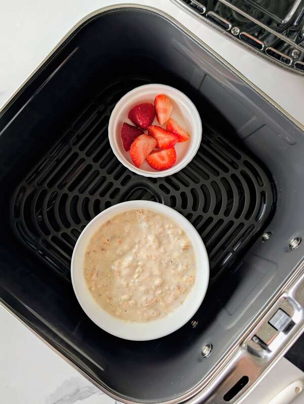 Try these quick 10-minute air fryer baked oats! A healthy, single-serve air fryer protein oatmeal recipe made with yogurt, no egg, and no banana.