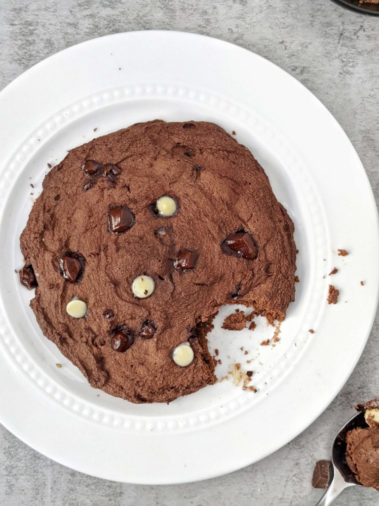 A very Big 6” Double Chocolate Protein Cookie made in the Microwave in under 2 minutes! This single serve protein cookie has no egg, no sugar and no oil; Perfect for a post workout or healthy dessert.