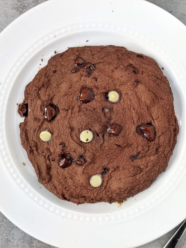 A very Big 6” Double Chocolate Protein Cookie made in the Microwave in under 2 minutes! This single serve protein cookie has no egg, no sugar and no oil; Perfect for a post workout or healthy dessert.