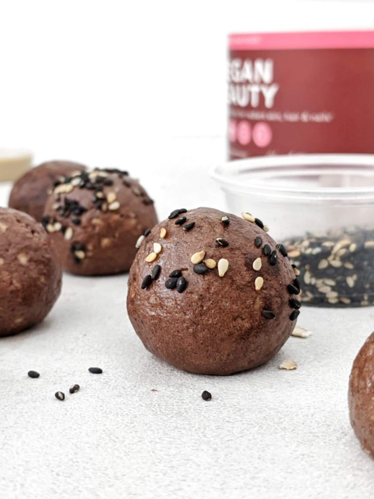 Super simple Chocolate Tahini Protein Balls that taste like soft dark chocolate truffles! Made with tahini, oat, protein powder and cacao, these easy no bake Tahini protein balls have a Keto option too.
