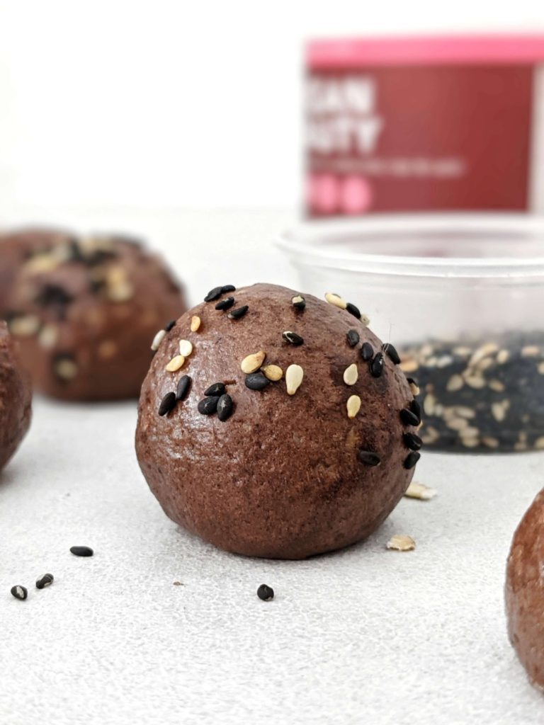 Super simple Chocolate Tahini Protein Balls that taste like soft dark chocolate truffles! Made with tahini, oat, protein powder and cacao, these easy no bake Tahini protein balls have a Keto option too.