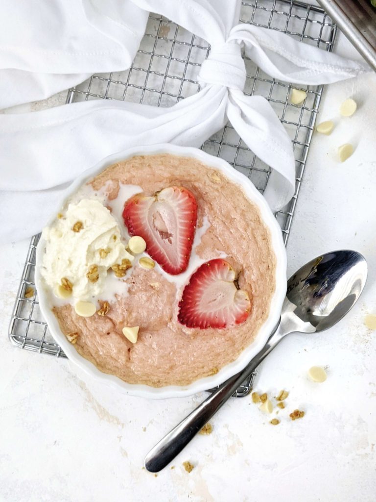 A high protein Strawberry Baked Oatmeal for One: Sweetened with protein powder and made creamy with greek yogurt, this strawberry protein baked oats is a healthy breakfast recipe that tastes just like a strawberries and cream dessert!