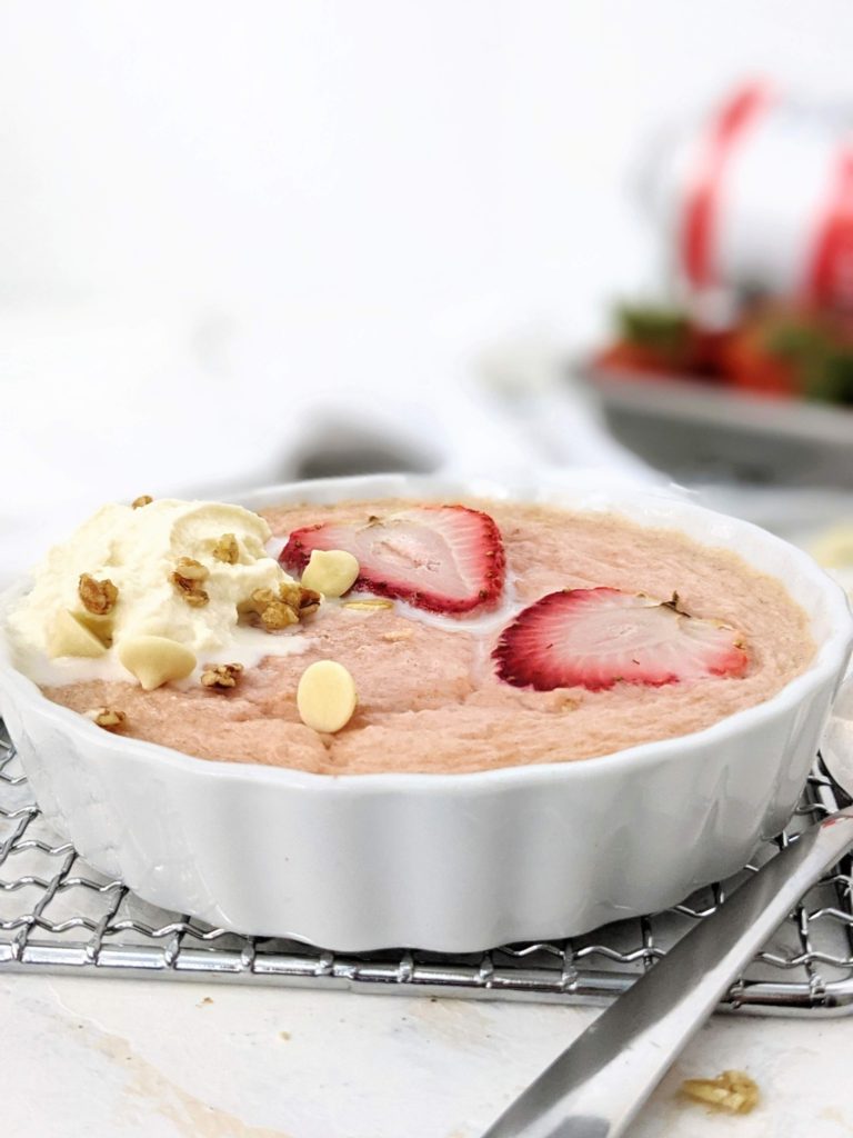 A high protein Strawberry Baked Oatmeal for One: Sweetened with protein powder and made creamy with greek yogurt, this strawberry protein baked oats is a healthy breakfast recipe that tastes just like a strawberries and cream dessert!