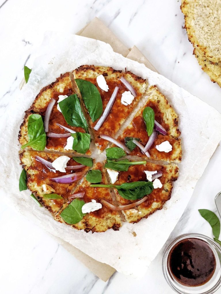 A healthy, low calorie and high protein Cauliflower Chicken Crust Pizza. With no flour and packed with chicken, this is a perfect gluten free, low carb, keto protein pizza crust for all your favorite toppings.