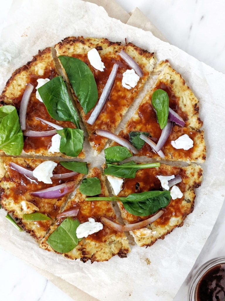 A healthy, low calorie and high protein Cauliflower Chicken Crust Pizza. With no flour and packed with chicken, this is a perfect gluten free, low carb, keto protein pizza crust for all your favorite toppings.