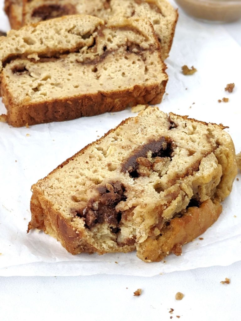 A Double Stuffed but Healthy Protein Banana Bread made with whole wheat flour, protein powder, no oil and no sugar! This oil free high protein banana bread is packed with layers of sugar free chocolate and Biscoff cookie butter and is perfect for a low calorie dessert or breakfast treat.