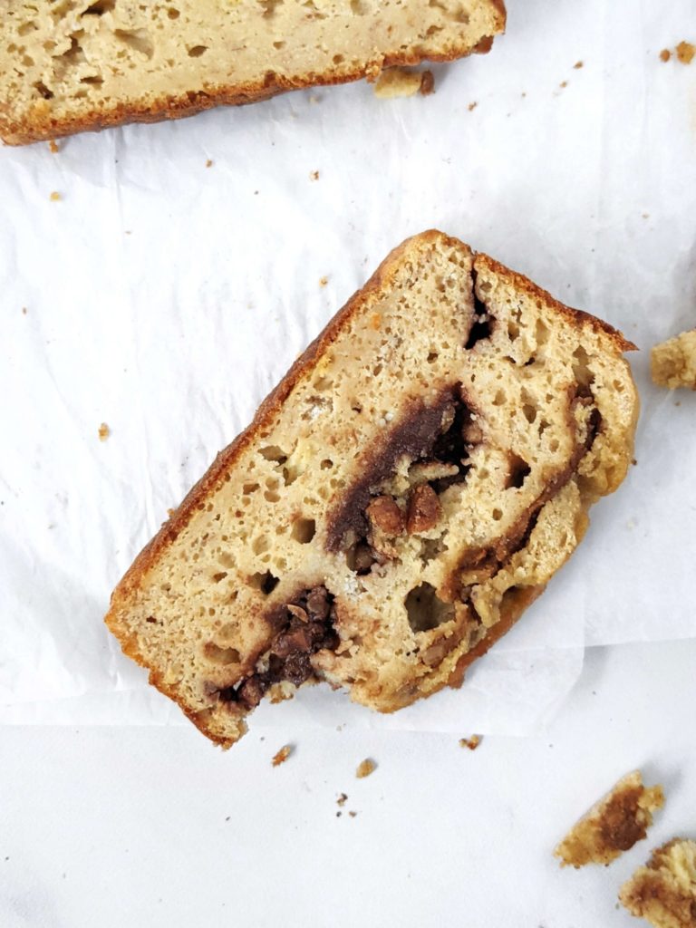 A Double Stuffed but Healthy Protein Banana Bread made with whole wheat flour, protein powder, no oil and no sugar! This oil free high protein banana bread is packed with layers of sugar free chocolate and Biscoff cookie butter and is perfect for a low calorie dessert or breakfast treat.