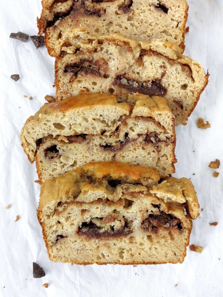 A Double Stuffed but Healthy Protein Banana Bread made with whole wheat flour, protein powder, no oil and no sugar! This oil free high protein banana bread is packed with layers of sugar free chocolate and Biscoff cookie butter and is perfect for a low calorie dessert or breakfast treat.