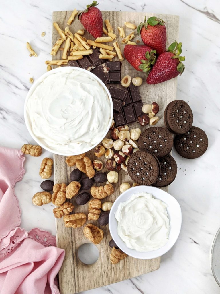 A truly easy and healthy Protein Cheesecake Dip with Greek Yogurt and protein powder, but no powdered sugar! 3 ingredient cheesecake dip is like a deconstructed cheesecake and a perfect protein powder fruit dip for dessert.