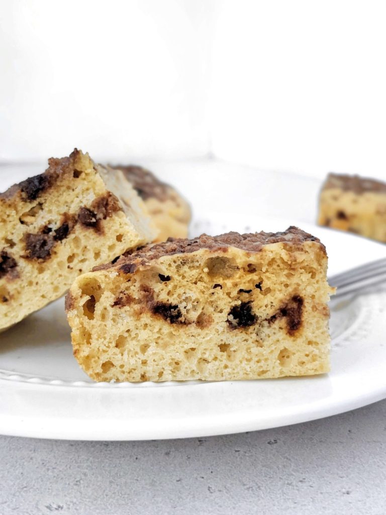 An easy Protein Coffee Cake complete with a Cinnamon Coffee Streusel, perfect for a healthy snack or dessert. Made with whole wheat pasty flour, Greek yogurt, only a little butter, and sweetened with protein powder, this recipe makes a high protein, sugar free and healthy coffee cake!