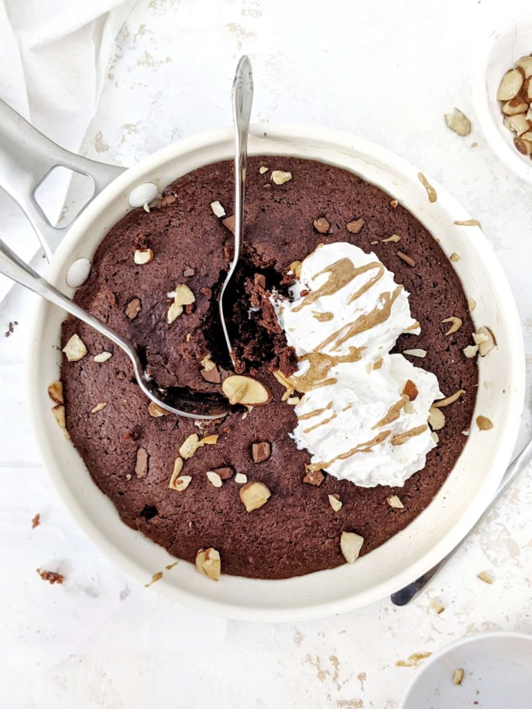 A rich, fudgy and insanely good Protein Skillet Brownie that’s actually healthy! Sweetened with protein powder and moistened with Greek yogurt, this protein brownie skillet is gluten free, has no sugar, no oil, no butter and no eggs either! A Vegan option too.