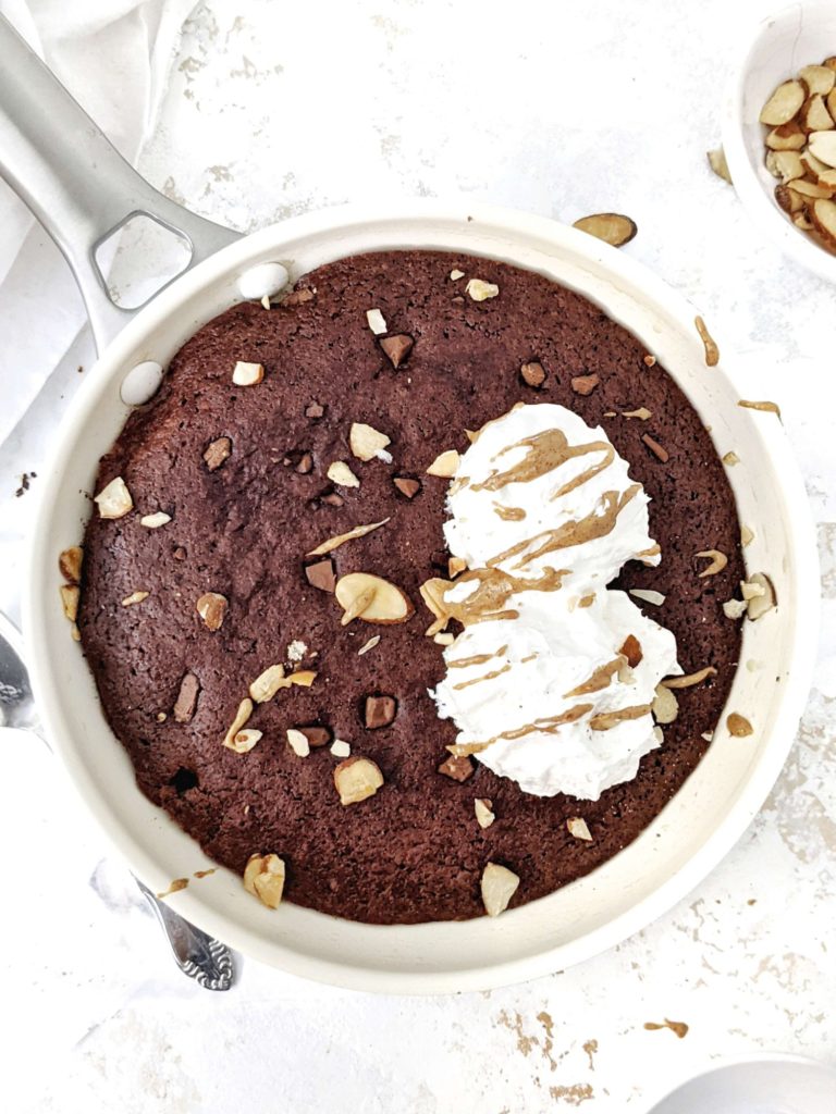 A rich, fudgy and insanely good Protein Skillet Brownie that’s actually healthy! Sweetened with protein powder and moistened with Greek yogurt, this protein brownie skillet is gluten free, has no sugar, no oil, no butter and no eggs either! A Vegan option too.