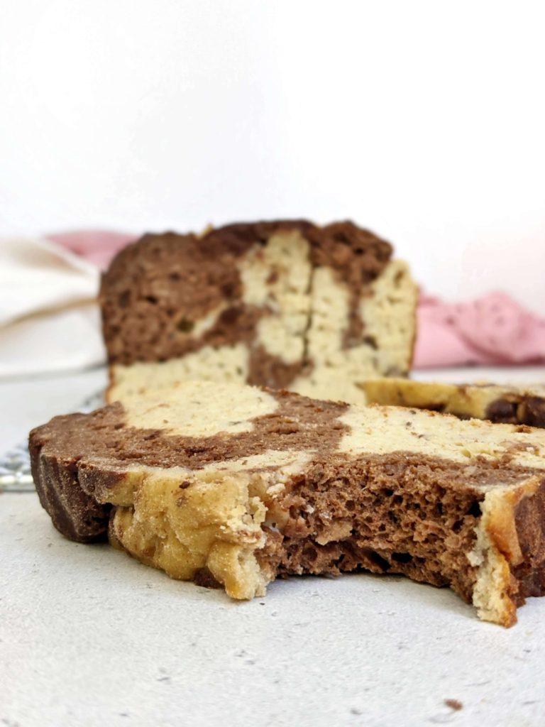 An attractive Marbled Protein Banana Bread made healthy with no oil, butter or sugar! This healthy chocolate swirl protein banana bread uses whole wheat pastry flour, Greek yogurt, protein powder and cocoa powder for all the flavor with no health compromises.