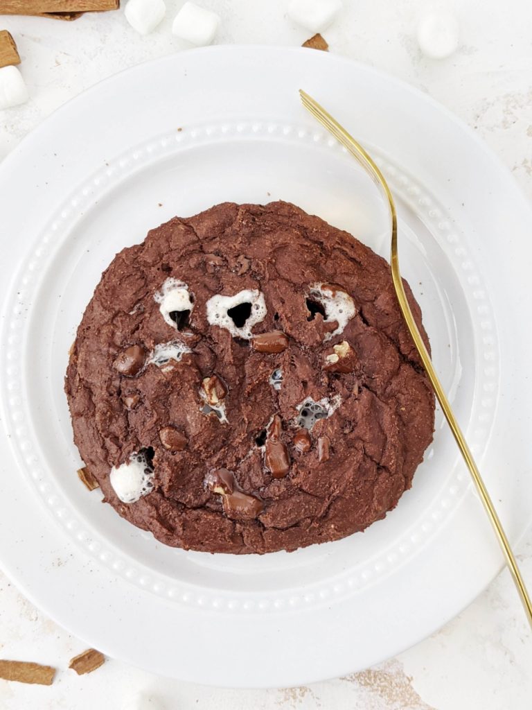 This Mexican Hot Chocolate Protein Cookie with marshmallows is just so good, but good for you! A healthy hot chocolate cookie with the spicy Mexican flavor and sweetened with protein powder; Vegan option too!