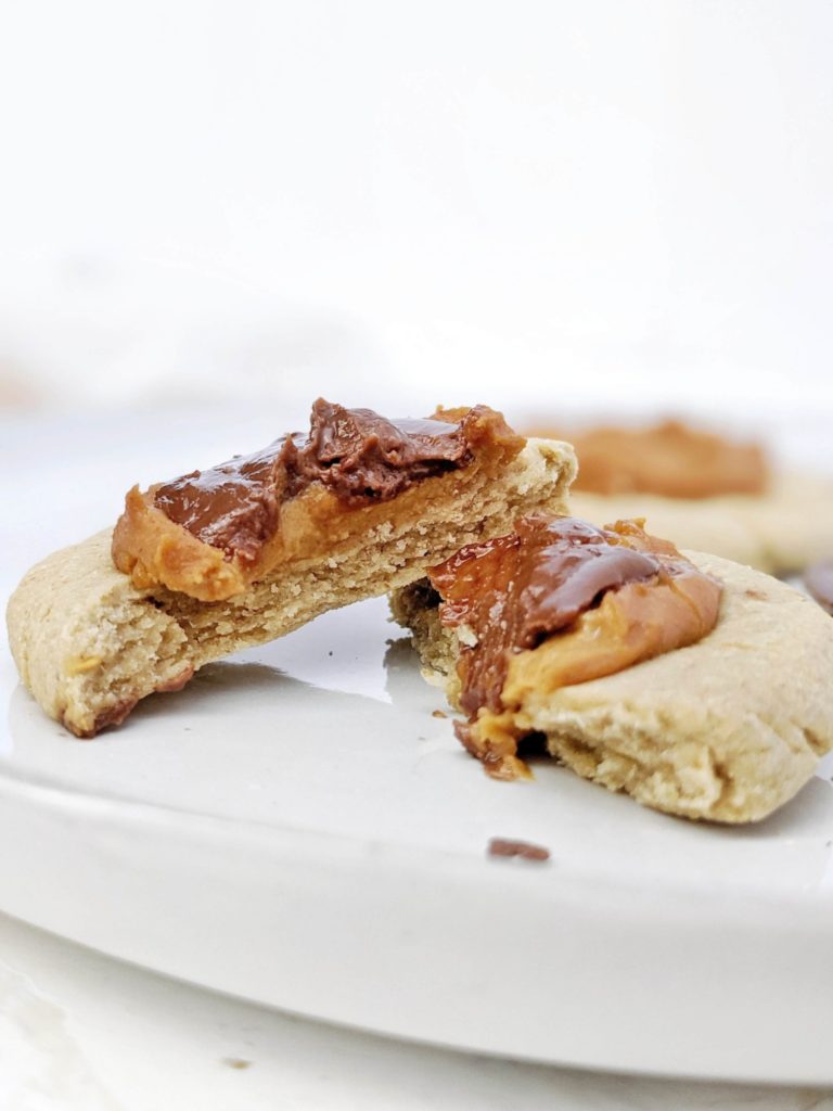 Beautiful Crumbl inspired Twix Protein Cookies made with a vegan and gluten free cookie, peanut butter protein caramel and sugar free chocolate. A copycat Crumbl Twix cookie at home, but healthy and high protein!