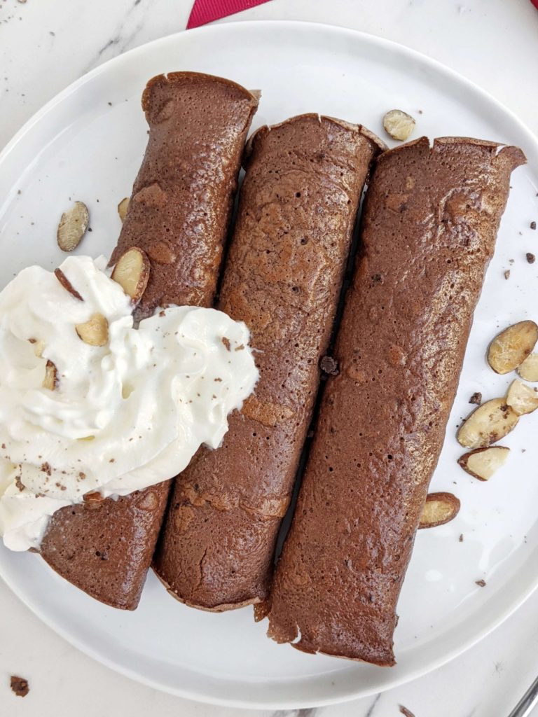 Unbelievable Chocolate Protein Crepes made with just 4 ingredients; No flour or sugar needed. These chocolate protein powder crepes are gluten free, dairy free, low carb, keto and easily Vegan too; The perfect breakfast, dessert or post workout treat.