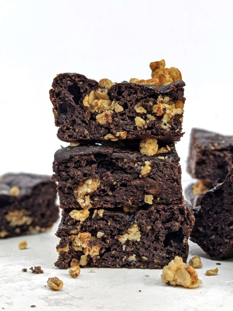 Rich and healthy Oatmeal Protein Brownies made with oat flour and granola mix-in truly are a dessert for breakfast! Low calorie oat flour protein brownies use cocoa powder and chocolate protein powder and have no eggs either.