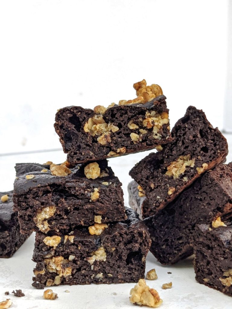 Rich and healthy Oatmeal Protein Brownies made with oat flour and granola mix-in truly are a dessert for breakfast! Low calorie oat flour protein brownies use cocoa powder and chocolate protein powder and have no eggs either.
