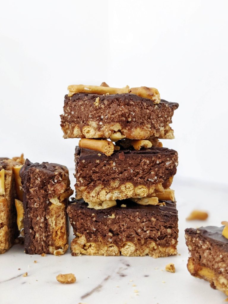 Beautiful layered Pretzel Protein Fudge Bars with the perfect sweet-salty and crunchy-fudgy combination! Chocolate pretzel protein bars are easy, healthy and sugar free; Perfect for a homemade on-the-go snack or post-workout treat!