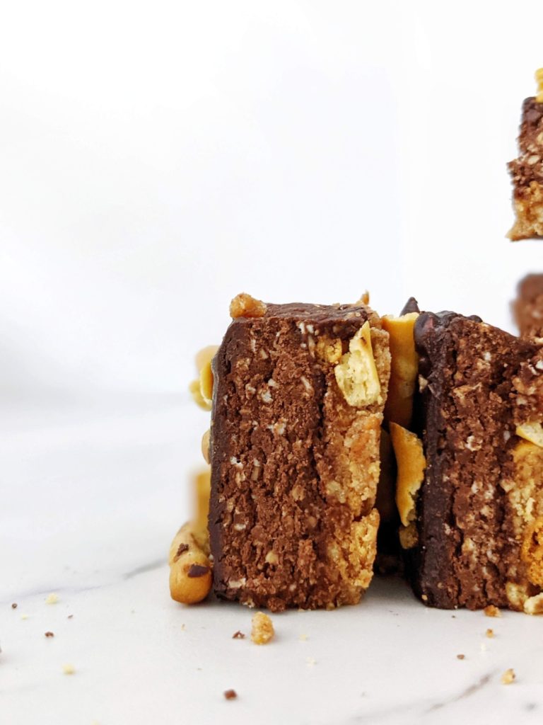 Beautiful layered Pretzel Protein Fudge Bars with the perfect sweet-salty and crunchy-fudgy combination! Chocolate pretzel protein bars are easy, healthy and sugar free; Perfect for a homemade on-the-go snack or post-workout treat!