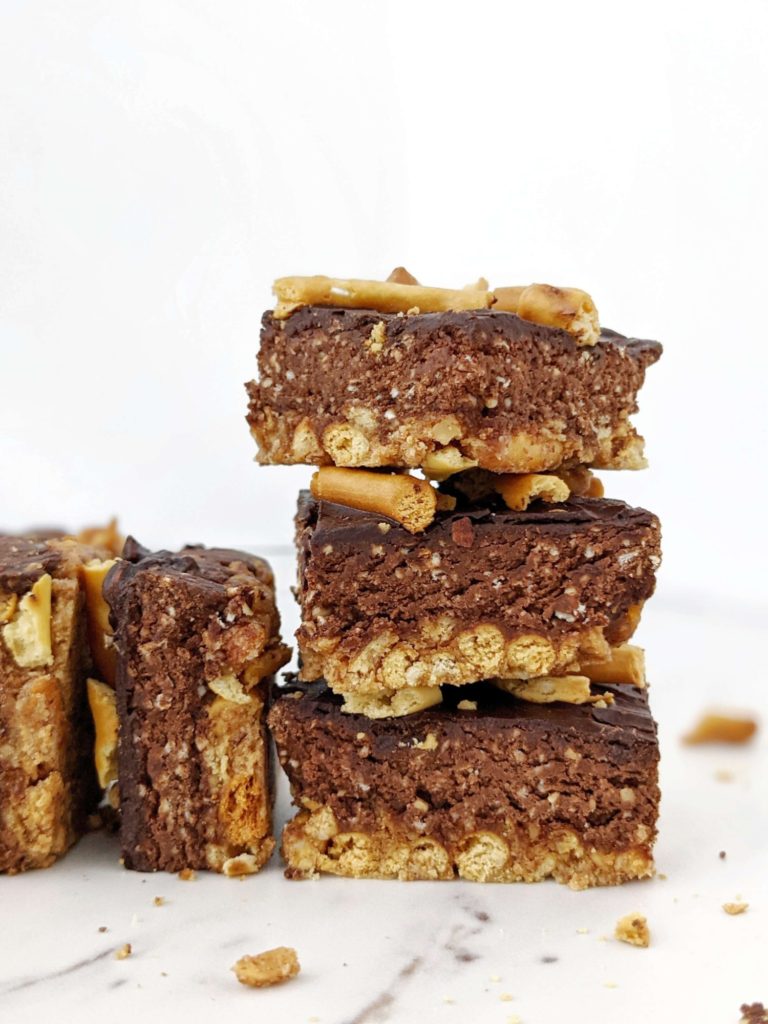 Beautiful layered Pretzel Protein Fudge Bars with the perfect sweet-salty and crunchy-fudgy combination! Chocolate pretzel protein bars are easy, healthy and sugar free; Perfect for a homemade on-the-go snack or post-workout treat!