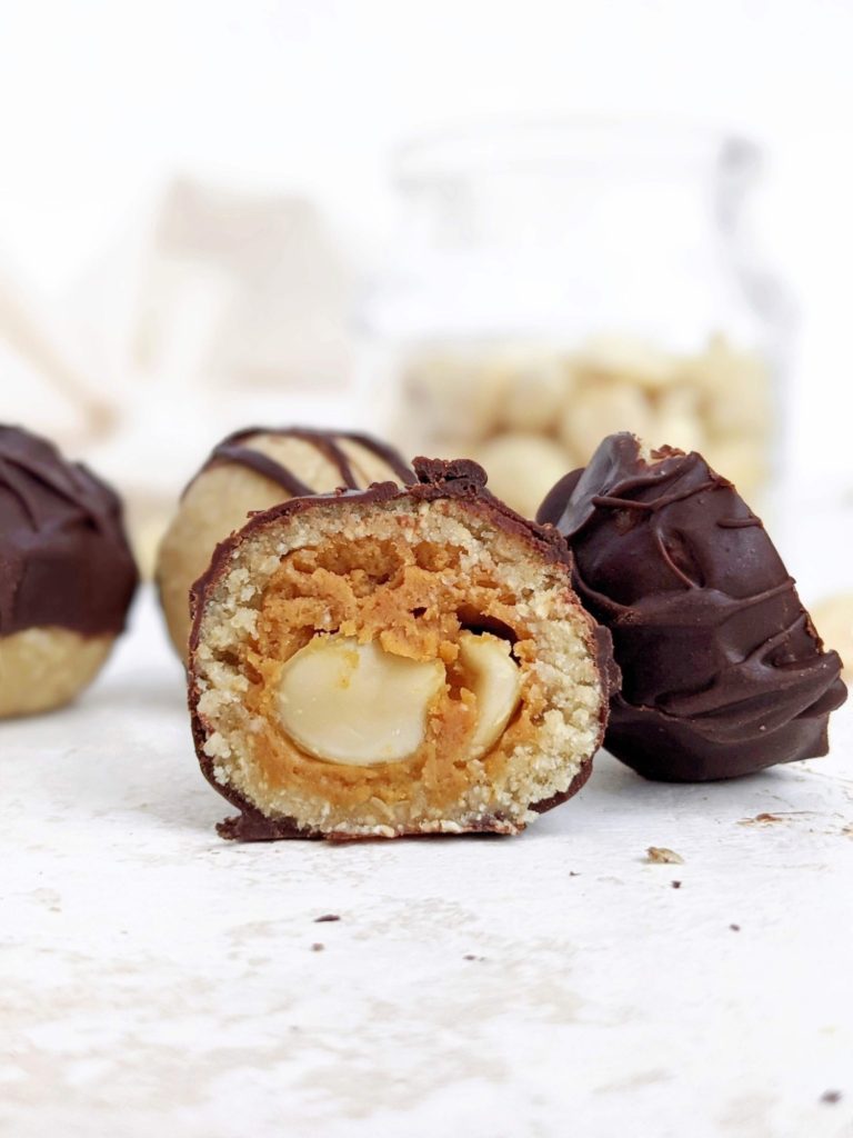 The perfect Snickers Protein Balls with all the candy layers - nougat, caramel, peanuts and chocolate - but healthy and easy too! These no bake Snickers protein bites are sweetened with protein powder so sugar free, and actually low fat, gluten free and Vegan too!