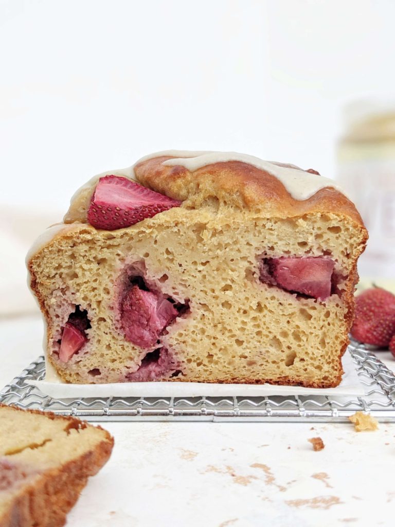 A pretty and pretty healthy Protein Strawberry Bread made with whole wheat flour and only a bit of oil. This low calorie healthy strawberry loaf bread is sweetened with protein powder and is perfect for a sugar free breakfast, dessert, snack or post workout!