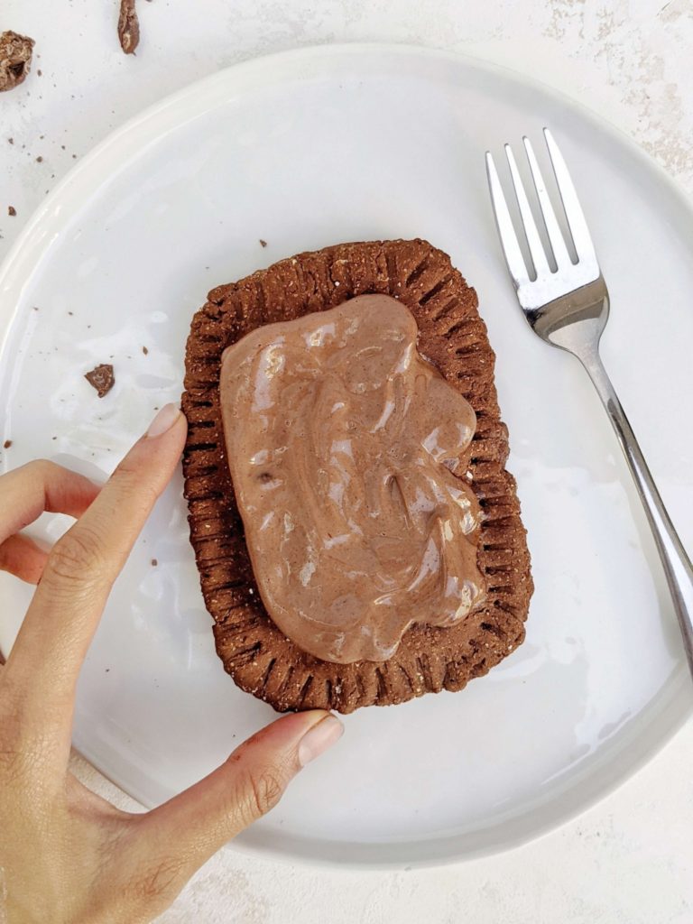 Supremely rich Triple Chocolate Protein Pop Tarts with a chocolate pastry dough, chocolate fudge filling, and frosting - all with protein powder as well! A perfect healthy homemade chocolate fudge pop tart that’s high in protein, gluten free, sugar free and Vegan too.