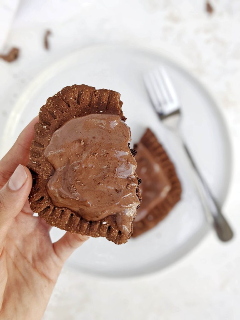 Supremely rich Triple Chocolate Protein Pop Tarts with a chocolate pastry dough, chocolate fudge filling, and frosting - all with protein powder as well! A perfect healthy homemade chocolate fudge pop tart that’s high in protein, gluten free, sugar free and Vegan too.