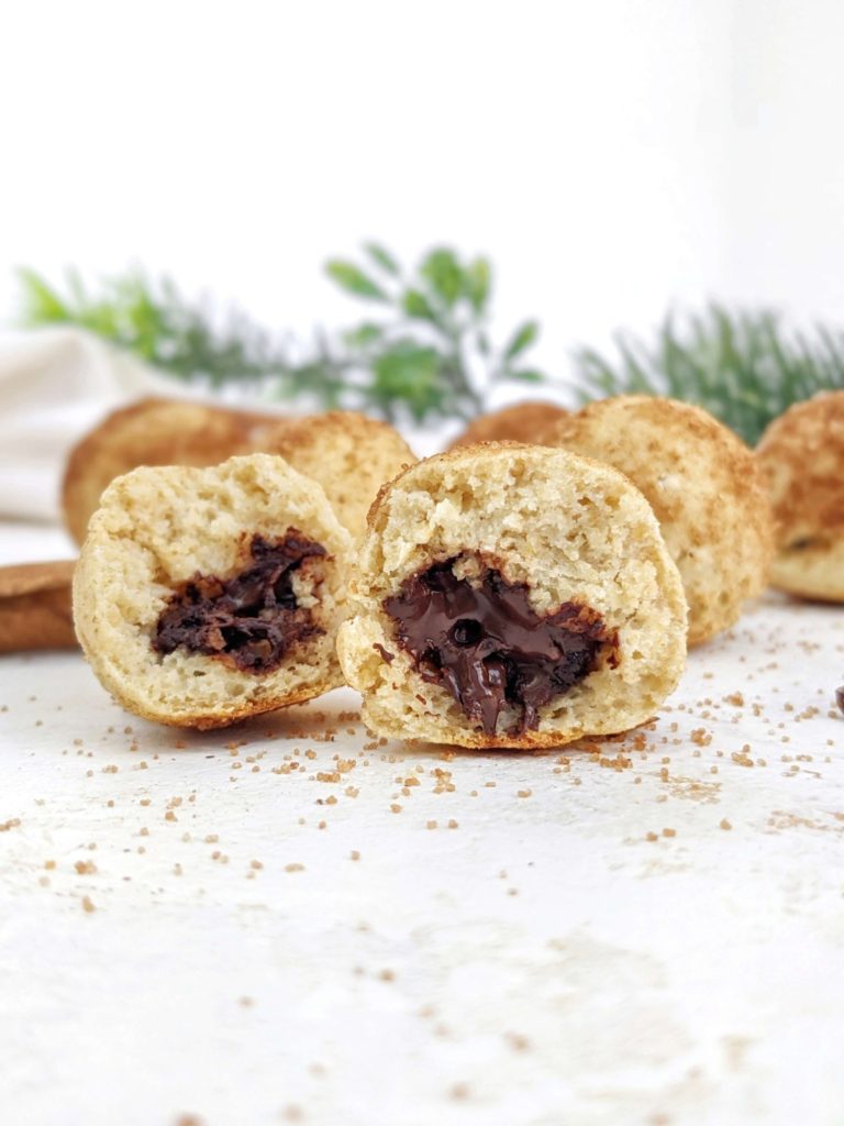 Incredible Chocolate stuffed Protein Churro Bites with just 4 ingredients, and easy! These churro inspired baked protein balls are stuffed with sugar free chocolate and coated with monk fruit cinnamon-sugar for a healthy, high protein dessert.