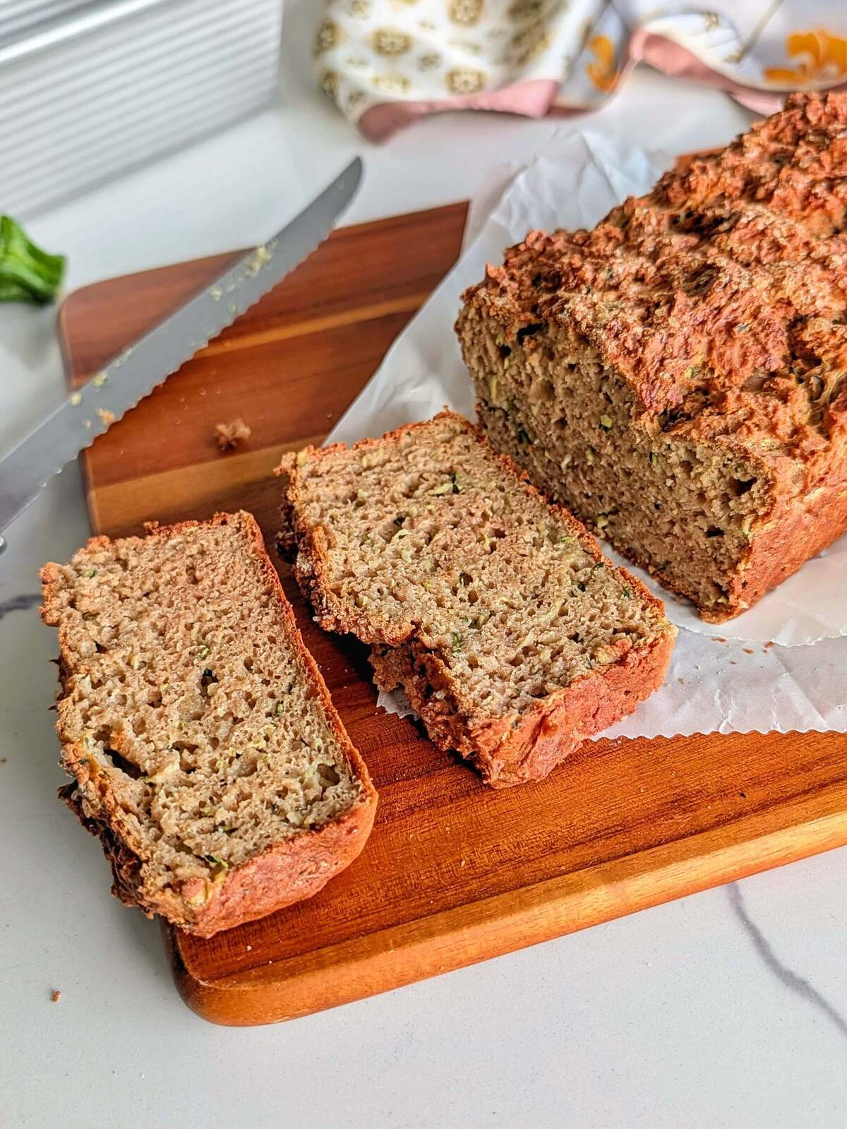 This protein zucchini bread is high protein, low fat and low sugar, with a crackly sugar top and 10g of protein a slice — good for breakfast, a snack, or after a heavy lifting session at the gym.