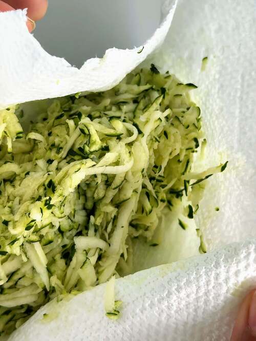 Squeeze out moisture from zucchini
