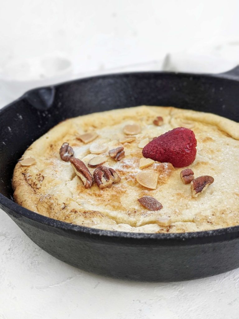 A big and extra high Protein Dutch Baby Pancake made with protein powder, Greek yogurt and an extra egg white too! This recipe for protein German pancakes is healthy, sugar free, and actually easy; The perfect breakfast or post workout meal.