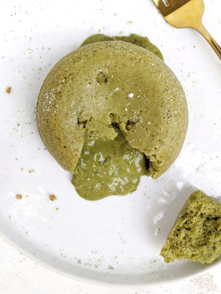 A truly simple Protein Matcha Lava Cake with protein powder and Greek Yogurt, but no white chocolate - low calorie, sugar and fat free! This molten lava matcha protein mug cake is moist, has the green tea flavor, but is healthy and easily Vegan too.