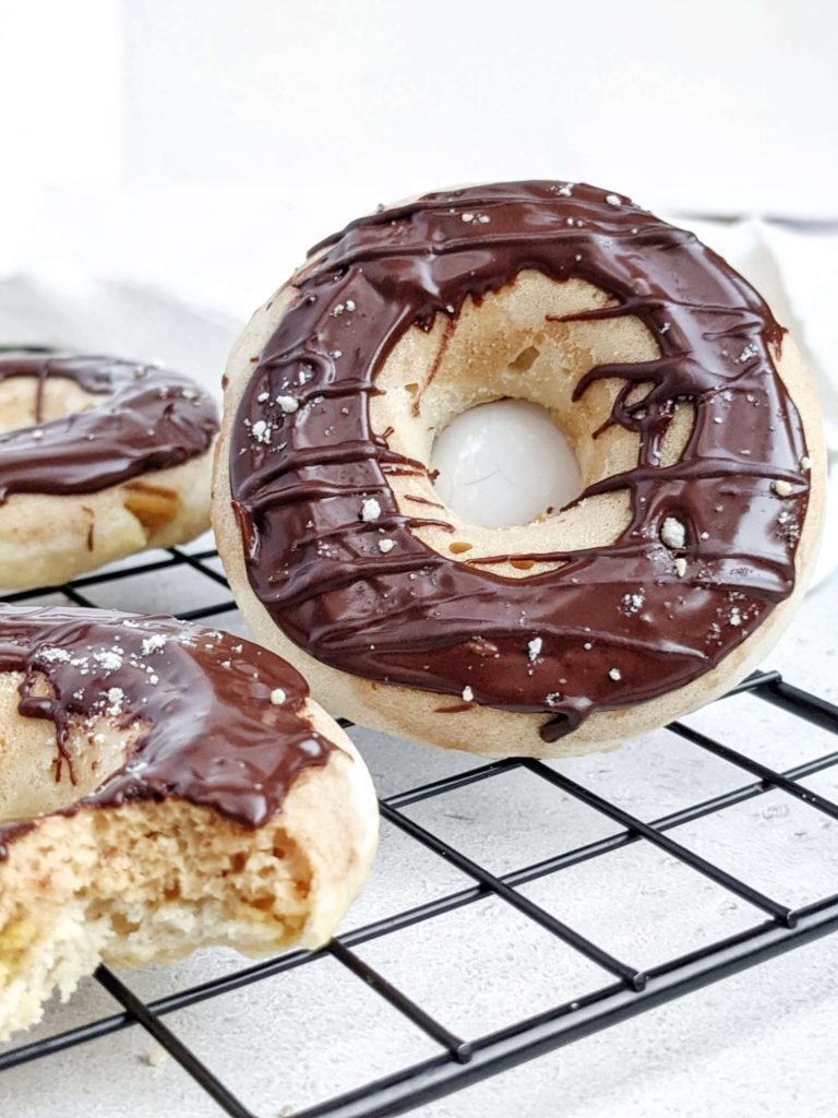 Realistic Twix Protein Donuts with vanilla and peanut butter caramel donut layers, chocolate glaze, and actual shortbread too! Healthy copycat Twix donuts use protein powder and are sugar free and low fat too.