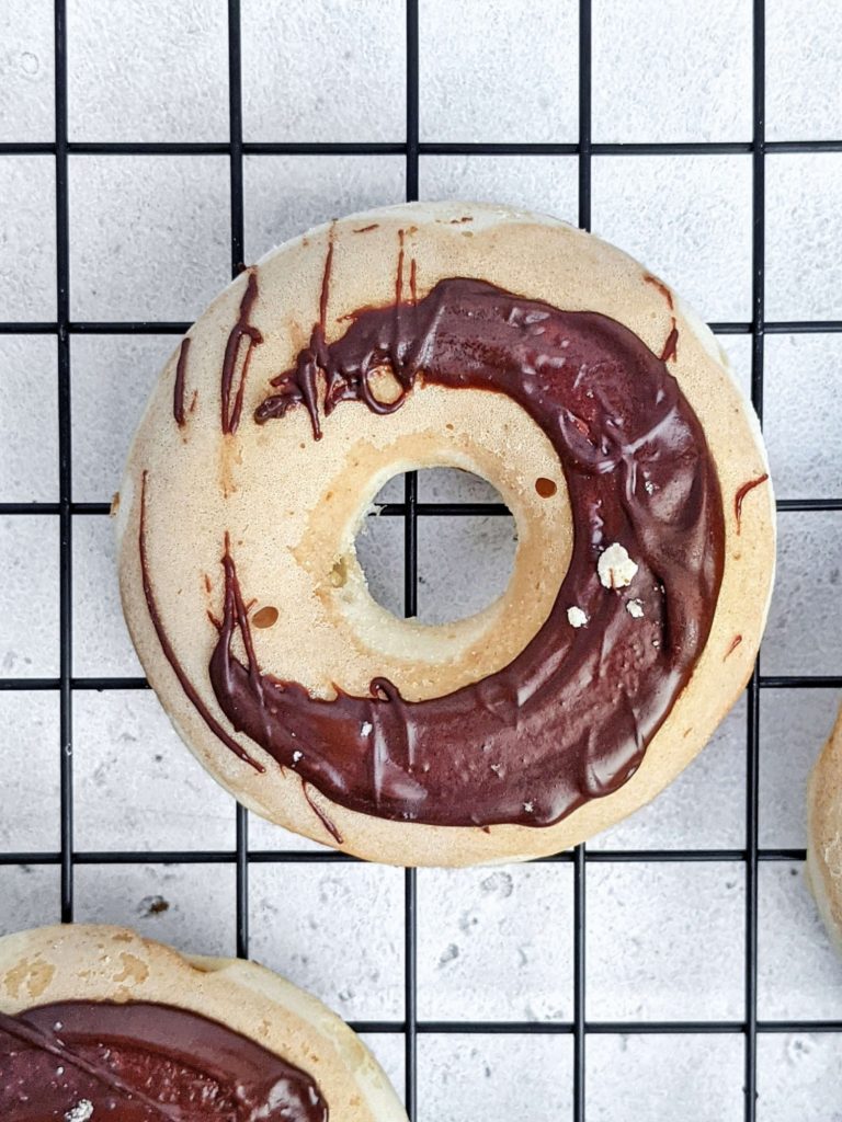 Realistic Twix Protein Donuts with vanilla and peanut butter caramel donut layers, chocolate glaze, and actual shortbread too! Healthy copycat Twix donuts use protein powder and are sugar free and low fat too.