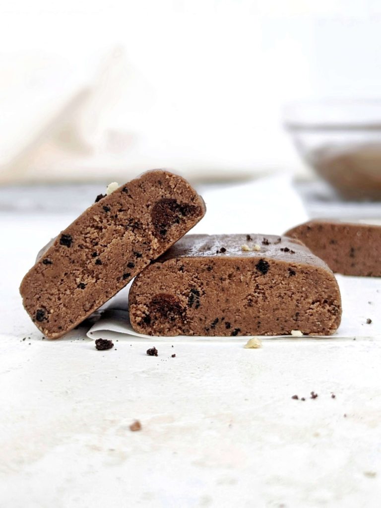 A truly magical no bake Chocolate Protein Fudge made just 3 ingredients! This healthy, low calorie protein fudge bar recipe uses protein powder, sugar free chocolate nut butter and coconut flour; No heavy cream needed.