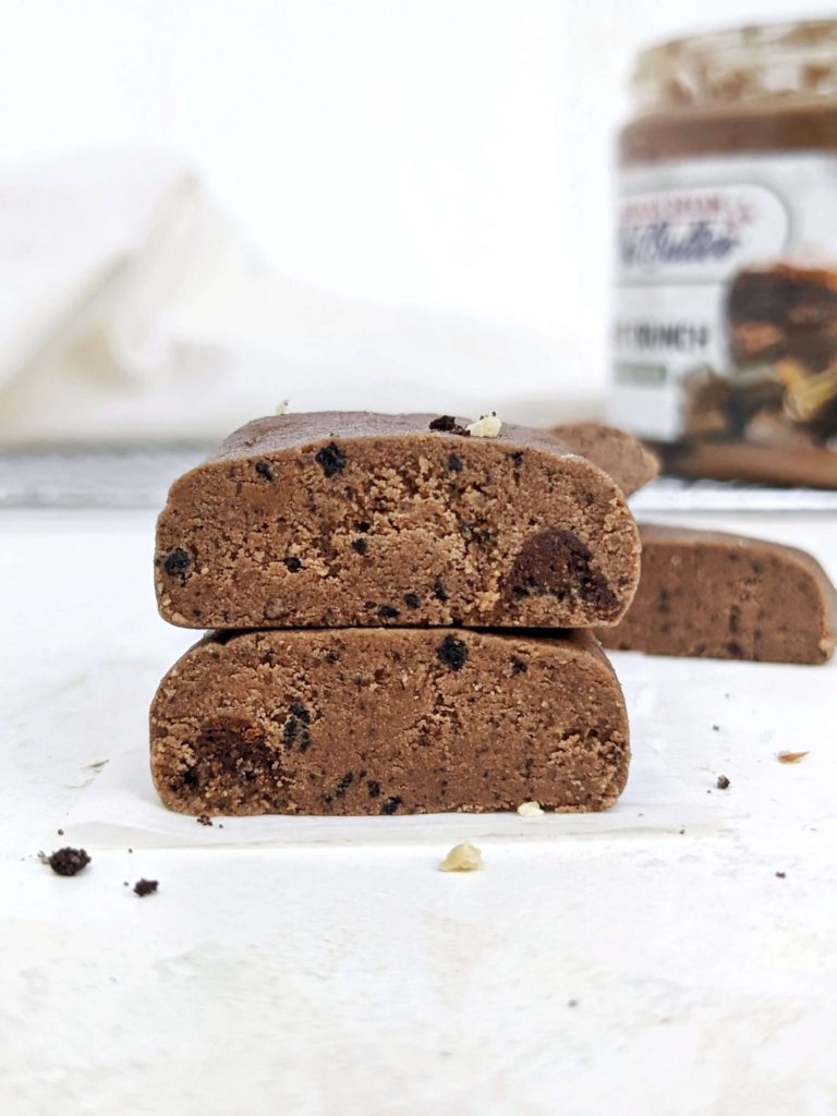 A truly magical no bake Chocolate Protein Fudge made just 3 ingredients! This healthy, low calorie protein fudge bar recipe uses protein powder, sugar free chocolate nut butter and coconut flour; No heavy cream needed.