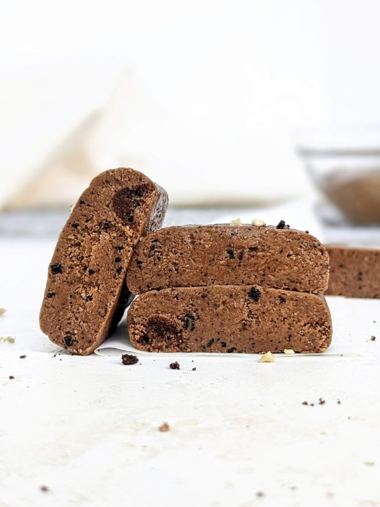 A truly magical no bake Chocolate Protein Fudge made just 3 ingredients! This healthy, low calorie protein fudge bar recipe uses protein powder, sugar free chocolate nut butter and coconut flour; No heavy cream needed.