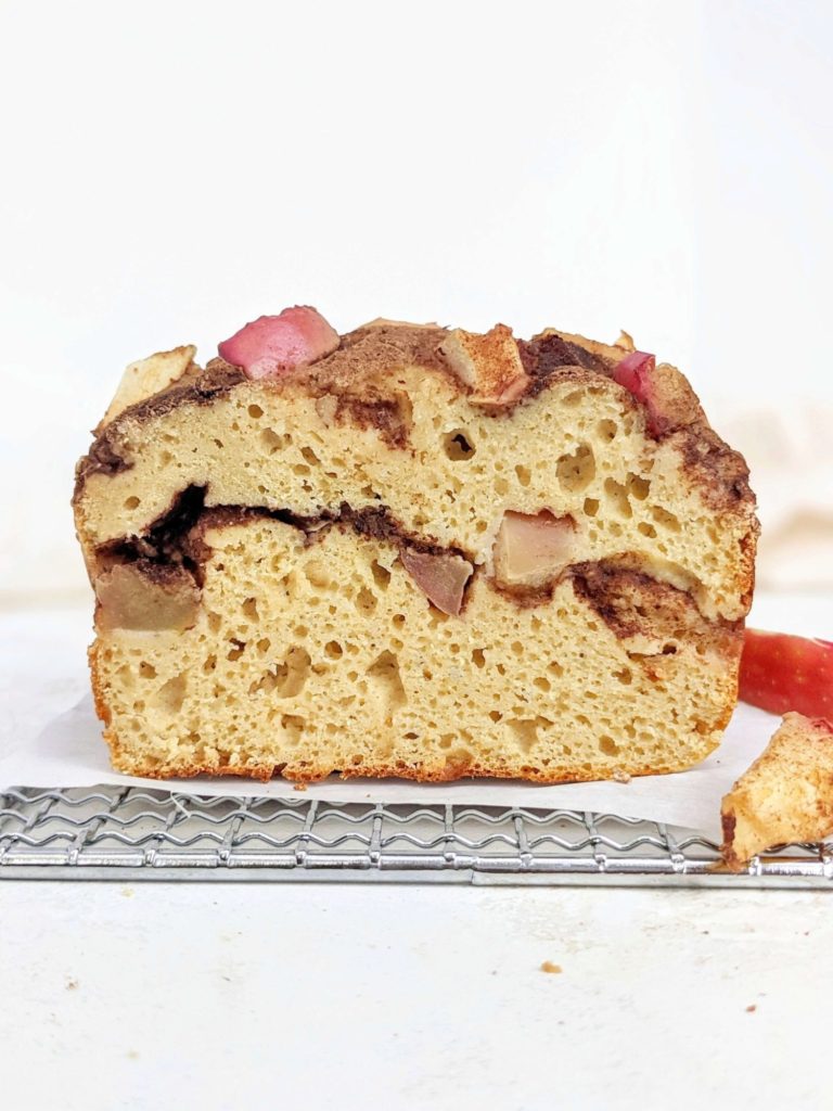 A super minimalistic Cinnamon Apple Protein Pancake Bread with 5 ingredients, a cinnamon swirl and chopped apples! This healthy apple cinnamon bread is made with pancake mix and protein powder, and makes a great quick bread for breakfast or post workout!