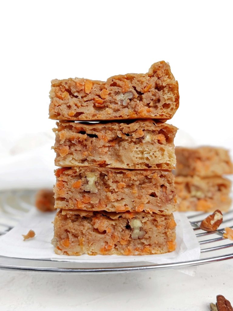 Dense, chewy and light Carrot Cake Protein Blondies with slight crunch of pecans. These healthy carrot cake blondies are made with protein powder, and have no butter; Gluten free, Vegan and sugar free too!