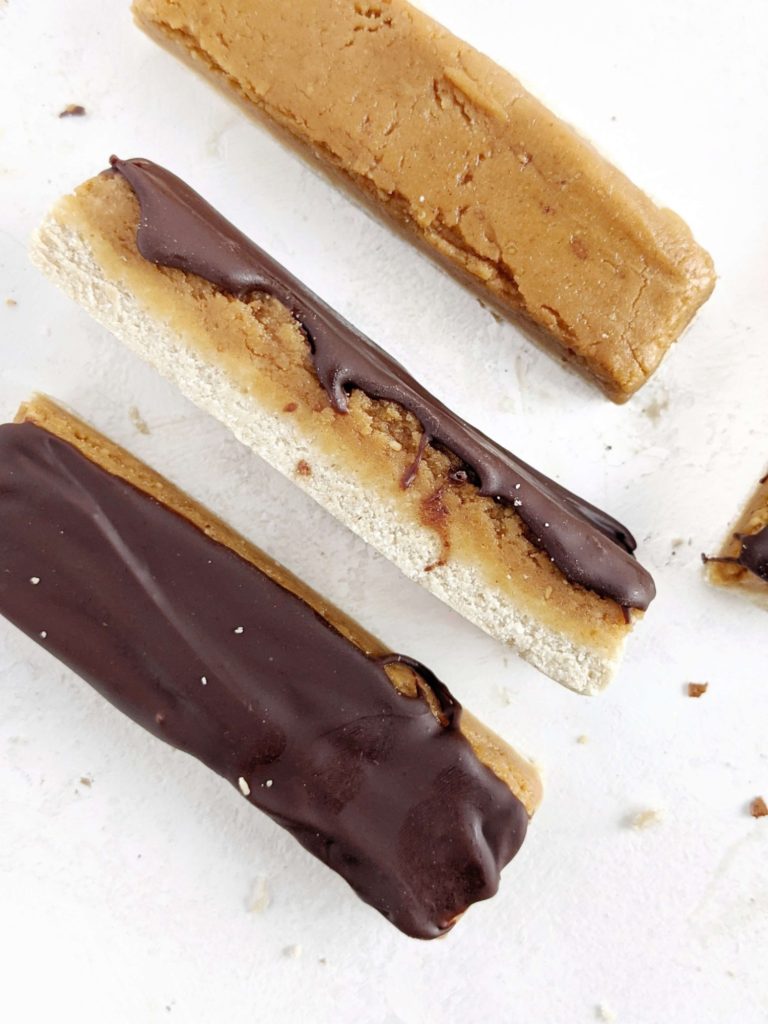 These Peanut Butter Protein Twix Bars are a healthy, homemade and high-protein version of the candy bar everyone loves. Twix protein bars are made with oat flour, protein powder and sugar free maple syrup and chocolate, for a gluten-free, Vegan and low calorie treat!