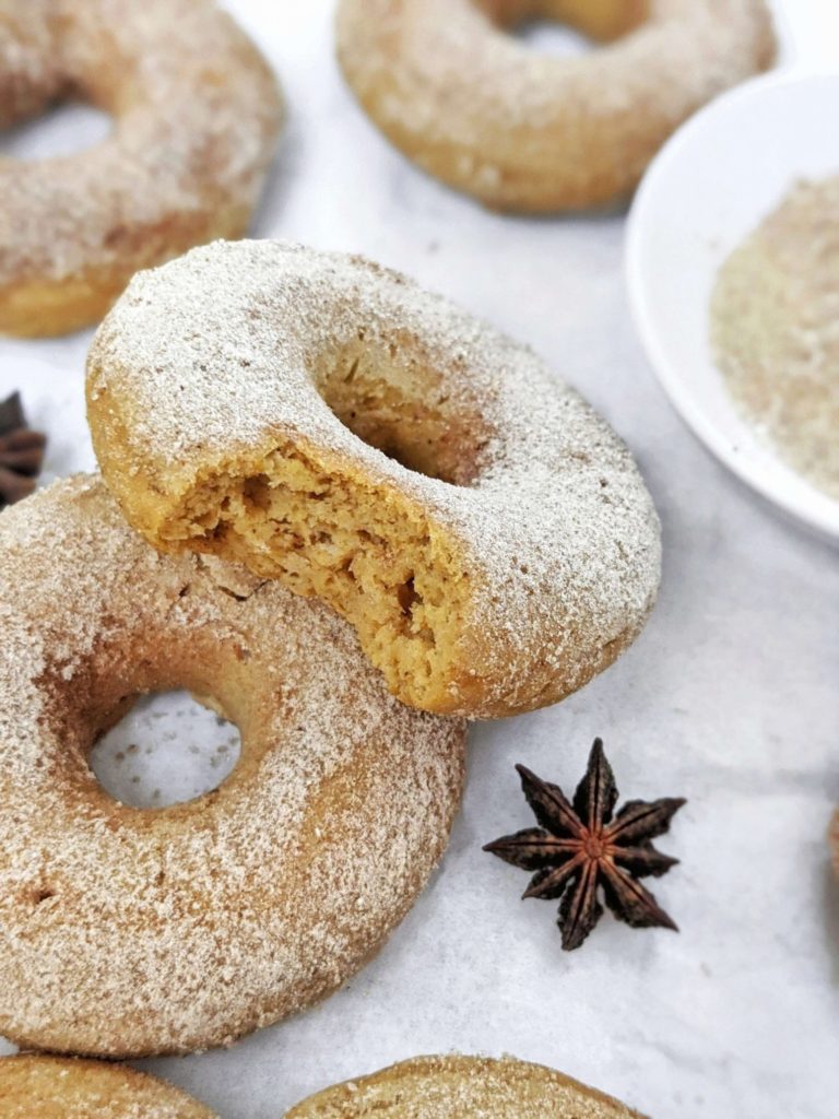 Fluffy and flavorful Chai-spiced Pumpkin Protein Donuts with a protein cinnamon sugar coating are the perfect Fall baked donuts! Healthy pumpkin protein powder donuts are sugar free and gluten free and will be your new favorite.