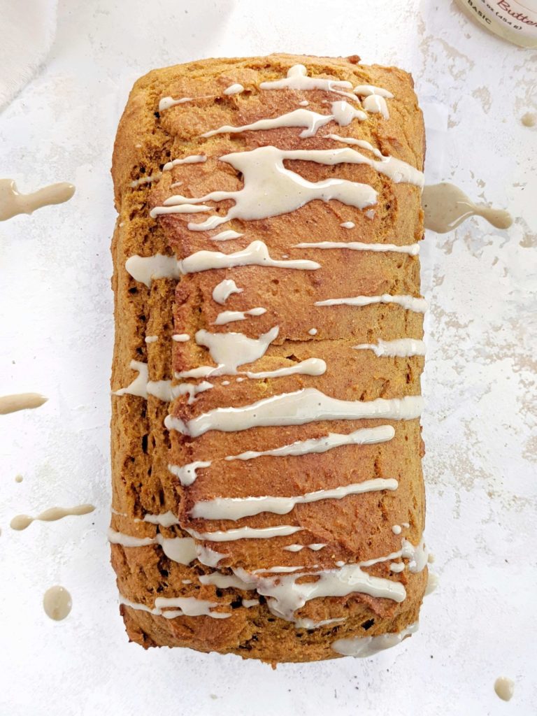 A super cozy Pumpkin Protein Pancake Bread topped with a maple cashew glaze! This healthy pumpkin pancake bread uses protein pancake mix, protein powder, sugar free maple syrup and no oil or butter. A delicious breakfast loaf for fall!